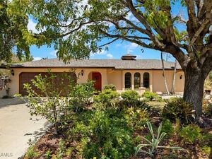 This charming 3-bedroom, 2-bath home sits on a rare corner d